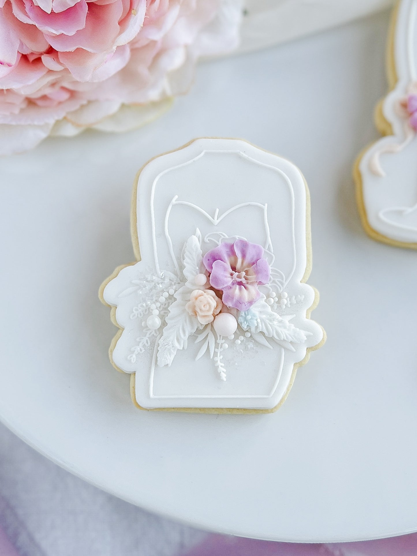 Bride holds her Bouquet + Cookie Cutter