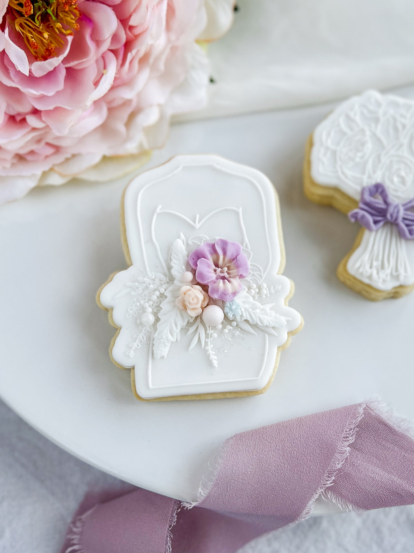 Bride holds her Bouquet + Cookie Cutter
